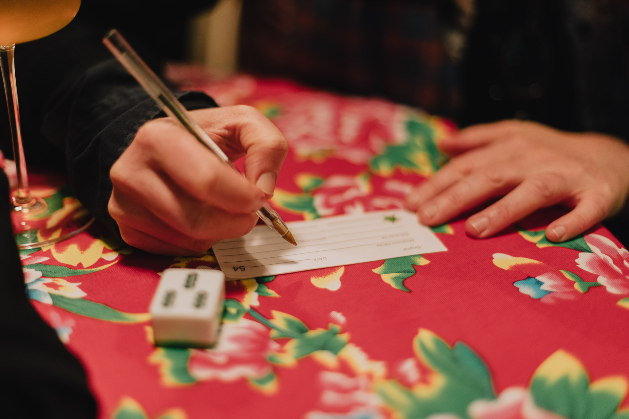 image of a hand writing a promise on a piece of paper