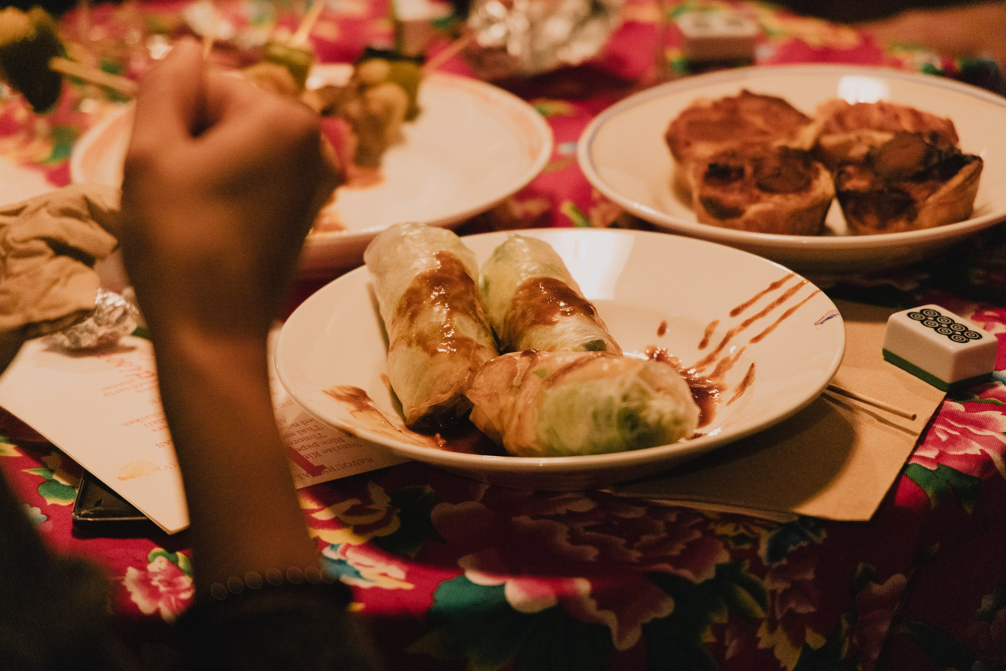 image of rice paper rolls and savoury tarts on the table